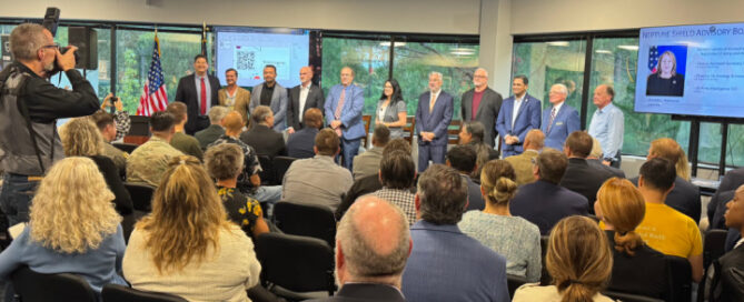 Neptune Shield leaders and community members gather for a ribbon cutting event in Hampton Roads, marking the opening of the veteran-focused business incubator and accelerator space.